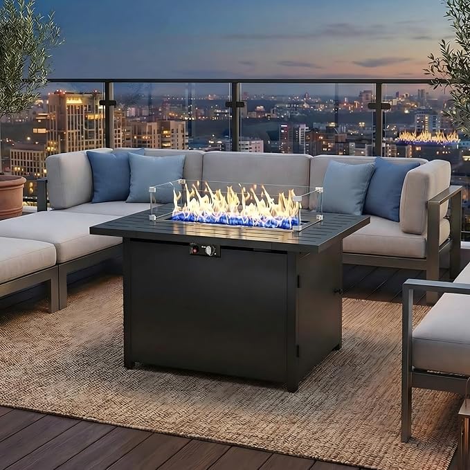 FansaFurn 43 inch propane fire pit table with lava rock on a backyard patio