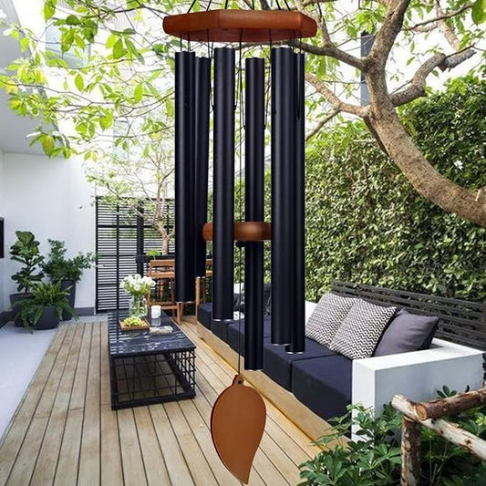 Large deep tone wind chime hanging in a garden