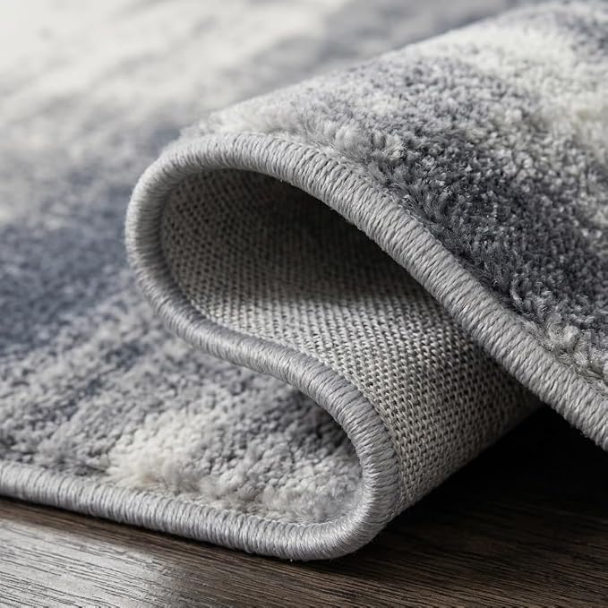 5x7 Navy Blue and Ivory Abstract Gradient Area Rug | Washable non-slip low-pile faux cashmere rug for living rooms, bedrooms and home offices; soft, foldable and easy to clean.